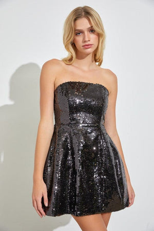 Oh-so-alluring, create a gorgeous formal look in the Ellie tube sequin mini dress. She features a sequin tube top, an open back with a fun short skirt,  The fsequins are STUNNING. Perfert to dance the night away or for a cool party poser.