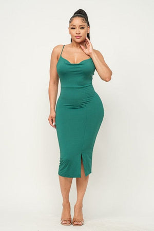 Your new favorite midi look! You will turn heads and look good in this hunter green slinky slip dress! It features a sleeveless cowl  neck, sleek spaghetti straps, a bodycon silhouette, and a short side slit. Slip-on design. Front view two.