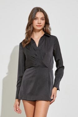Your next celebration adventure calls for this trendy  black romper! Party comfortably in this romper featuring long sleeves with cuffs, a collared neckline, wrap front  and short-length skirt look from the front.
