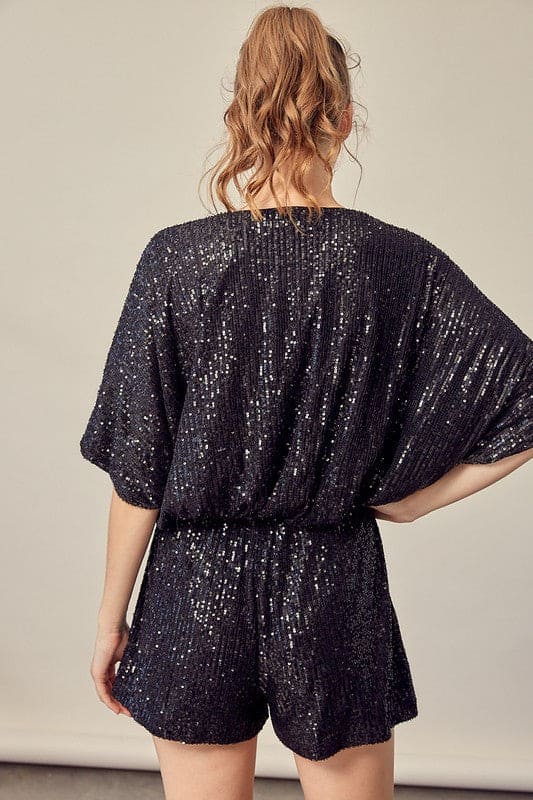 Sequin embroidery, with matching accented belt and meticulously detailed construction. This romper with POCKETS features the right amount of sass for a ton of FUN, FUN,FUN! Back view shows  an elegant romper with an easy fit.  www.shopthetags.com