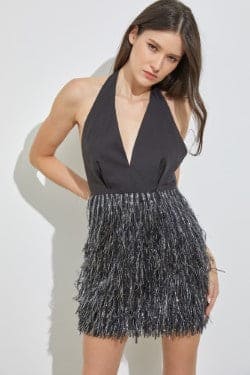 Chic and fab, this Heather fringe mini dress will showcase your curves and give off a flirty flair. This halter features a  plunging neckline, high-rise waist, a mini-length hem with a chic  fringe skirt, and a form-enhancing silhouette. Front