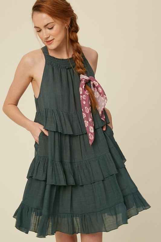 Crafted from breezy textured cotton the Lauren features  a flattering halter neckline , keyhole back with ties and descends into a tiered knee-grazing silhouette. This classic lined dress by Listicle is beautifully made and makes a wonderful impression for years to come. Please note that each piece in the Deerfield Collection has pockets. www.shopthetags.com