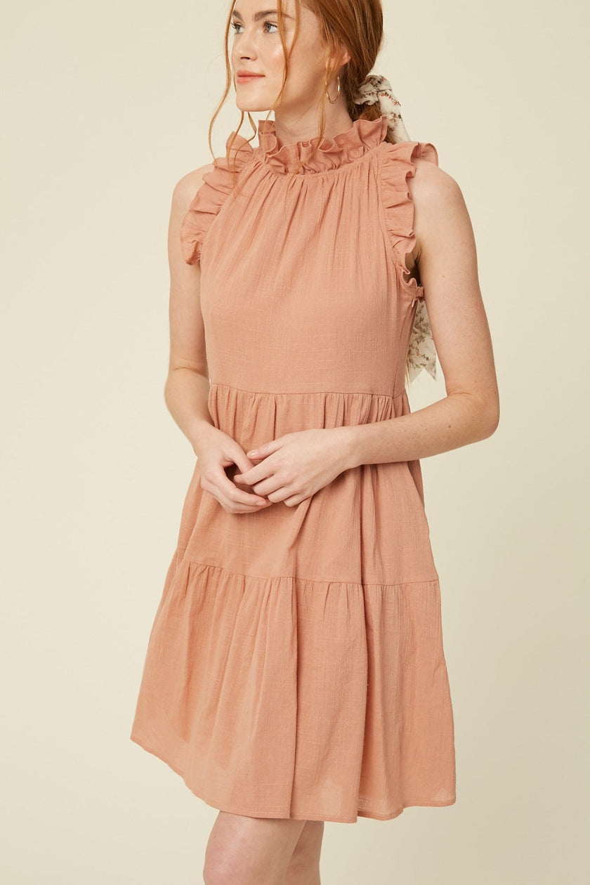 Crafted from breezy textured cotton the Bianca boast a flattering ruffled halter neckline , keyhole back with ties and descends into a tiered knee-grazing silhouette. This classic linen lined dress is beautifully made and makes a wonderful impression for years to come. Please note that each piece in the Deerfield Collection has pockets. www.hoytietoytie.com