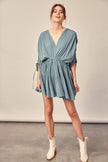 Ideal for a casual affair or an elegant evening, the Leah dress offers an unparalleled blend of vintage styling and high street fashion. Featuring a shirring sleeve, this pleated faded green dress offers a soft feminine fabric  and a flowing shape. Say yes to this dress for a guilt free serving of elegance. www.shopthetags.com