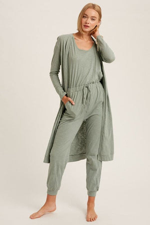 The Nia jumpsuit and cardigan set is back for the Fall season as one of our favorite additions to our loungewear pieces. Nia is a the perfect combination of a sleeveless jumpsuit paired with a long sleeve ,long cardigan with pockets for the complete matching look. This is junior cut, so if you like things on the loose side we suggest sizing up.