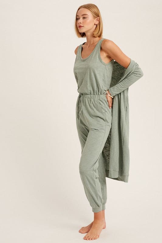 The Nia jumpsuit and cardigan set is back for the Fall season as one of our favorite additions to our loungewear pieces. Nia is a the perfect combination of a sleeveless jumpsuit paired with a long sleeve ,long cardigan with pockets for the complete matching look. This is junior cut, so if you like things on the loose side we suggest sizing up.
