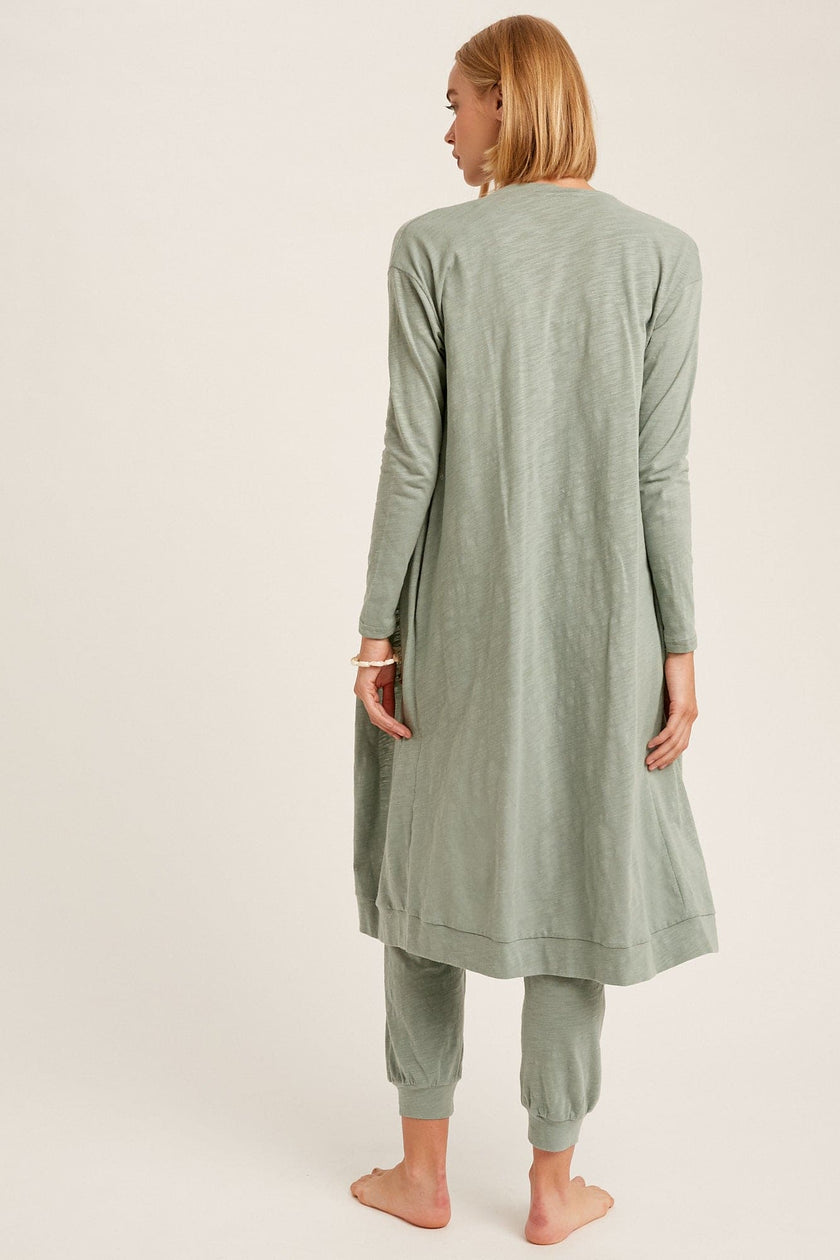 The Nia jumpsuit and cardigan set is back for the Fall season as one of our favorite additions to our loungewear pieces. Nia is a the perfect combination of a sleeveless jumpsuit paired with a long sleeve ,long cardigan with pockets for the complete matching look. This is junior cut, so if you like things on the loose side we suggest sizing up.