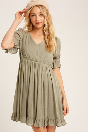 This baby doll style is made from textured woven fabric, fully lined and is cut to a flattering loose fit for a playful yet sophisticated look. Our round-neck babydoll dress featuring puffed sleeves with elastic cuffs with cord accent, back buttoned closure and a full, flirty ruffled hem. Wear as is, or add definition to the elasticized waist using a fashionable belt. Now available in ginger - a Classic Style and a staple for every wardrobe. www.shopthetags.com