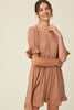 Our round-neck babydoll dress by Listicle featuring puffed sleeves with elastic cuffs with cord accent, back buttoned closure and a full, flirty ruffled hem. Wear as is, or add definition to the elasticized waist using a fashionable belt. This signature style is crafted from textured woven fabric, fully lined and is cut to a flattering loose fit for a playful yet sophisticated look.Now available in ginger - a Classic Style and a staple for every wardrobe. www.hoytietoytie.com