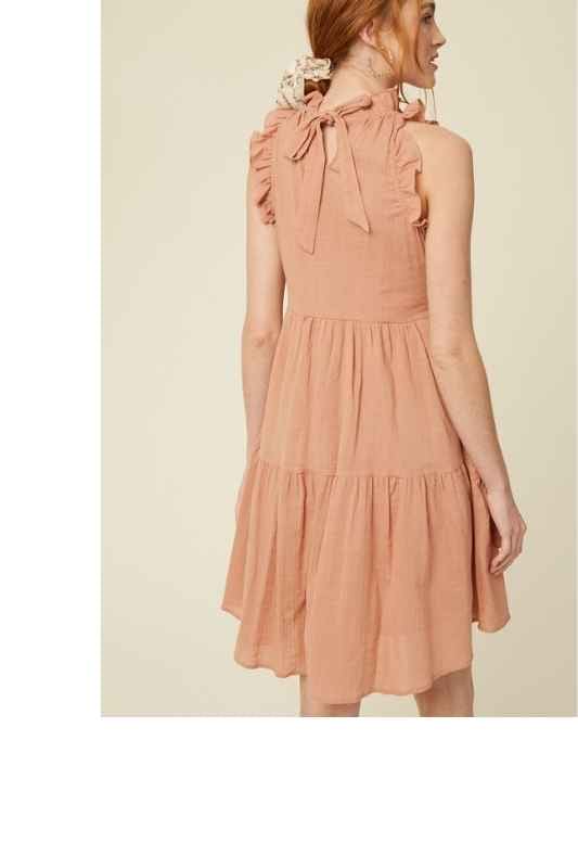 Crafted from breezy textured cotton the Bianca boast a flattering ruffled halter neckline , keyhole back with ties and descends into a tiered knee-grazing silhouette. This classic linen lined dress is beautifully made and makes a wonderful impression for years to come. Please note that each piece in the Deerfield Collection has pockets. www.hoytietoytie.com