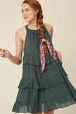 Crafted from breezy textured cotton the Lauren features  a flattering halter neckline , keyhole back with ties and descends into a tiered knee-grazing silhouette. This classic lined dress by Listicle is beautifully made and makes a wonderful impression for years to come. Please note that each piece in the Deerfield Collection has pockets. www.shopthetags.com